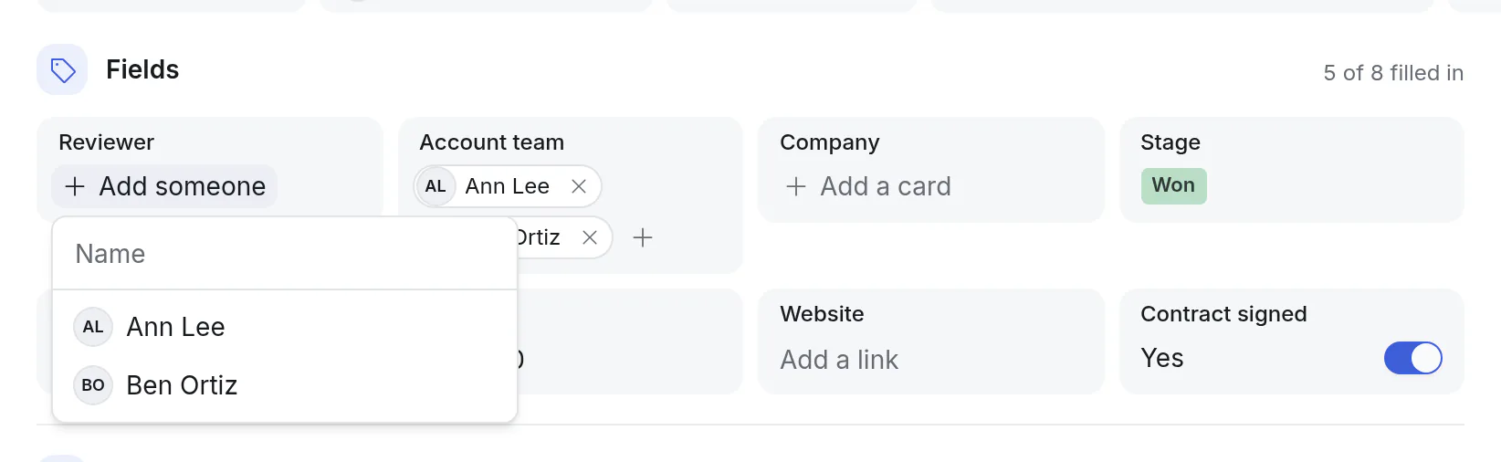 A card with a Reviewer and an Account team, and the list of people to pick from